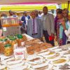 Kabanekera Annet form the bakery class (right) shows a variety of products they can make this was during the Presidential Initiative on skilling the Girl/Boy Child project 7th intake inspection of the skills of the students as they show case their work at Sub-way Centre on 23rd February 2023. Photo by PPU/Tony Rujuta.