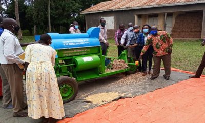 Kilimo Trust together with the sub county team on the rightside handing over a soybean thresher machine to Gwokere Nambieso growers cooperatives society Ltd, Kwania district, Nambieso sub county, Bung Parish.